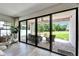 Expansive sliding glass doors open to the outdoor patio, extending living space at 13042 Pennybrook Dr, Riverview, FL 33579