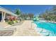 The community pool has plenty of lounge chairs and features a splashpad playset at 13042 Pennybrook Dr, Riverview, FL 33579
