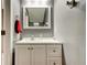 Bathroom featuring white vanity with drawers and cabinet space, sink, mirror, and neutral paint at 13923 Arbor Pines Dr, Riverview, FL 33579