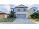 Charming two-story home with a well-maintained lawn and a two-car garage at 13923 Arbor Pines Dr, Riverview, FL 33579