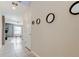 Hallway with tile flooring and modern decor at 13923 Arbor Pines Dr, Riverview, FL 33579
