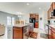 Open concept kitchen with stainless steel appliances, a large island, and modern cabinetry at 13923 Arbor Pines Dr, Riverview, FL 33579