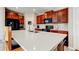Modern kitchen featuring stainless steel appliances, an island and a breakfast bar at 13923 Arbor Pines Dr, Riverview, FL 33579