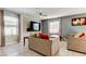 Stylish living room featuring neutral colors and modern furnishings at 13923 Arbor Pines Dr, Riverview, FL 33579