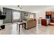 Cozy living room with tile floors and a modern color palette at 13923 Arbor Pines Dr, Riverview, FL 33579