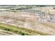 Community aerial with serene ponds, showcasing home development amid natural landscapes, perfect for a balanced lifestyle at 15238 Rainbow Quartz St, Wimauma, FL 33598