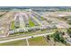 Neighborhood aerial showcasing well-placed homes on green lawns, highlighting the community's design and tranquil suburban living at 15238 Rainbow Quartz St, Wimauma, FL 33598