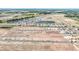 Scenic aerial view of homes and ponds, showcasing harmonious blend of nature and community development, promoting tranquil living at 15238 Rainbow Quartz St, Wimauma, FL 33598