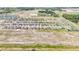 Neighborhood aerial featuring the harmonious blend of homes and natural landscapes, ideal for a tranquil suburban experience at 15238 Rainbow Quartz St, Wimauma, FL 33598