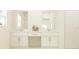 Elegant bathroom featuring double vanity with modern fixtures, sleek cabinetry, and a bright, clean aesthetic at 15238 Rainbow Quartz St, Wimauma, FL 33598