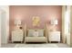 Cozy Bedroom with a light wood crib, lamps, pastel pink wall, and a geometric patterned rug at 15238 Rainbow Quartz St, Wimauma, FL 33598