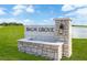 Stone sign at Balm Grove community entrance under a blue sky at 15238 Rainbow Quartz St, Wimauma, FL 33598