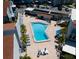 An aerial shot showcasing the uniquely shaped community pool and surrounding lounge area at 171 Medallion Blvd # F, Madeira Beach, FL 33708