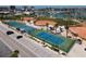 Aerial view of the well maintained tennis and basketball courts, and green softball field at 171 Medallion Blvd # F, Madeira Beach, FL 33708