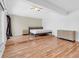 Spacious bedroom features wood floors, a ceiling fan, and a large window offering natural light at 171 Medallion Blvd # F, Madeira Beach, FL 33708