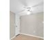 Bedroom featuring neutral walls, a ceiling fan, tile floors, and a white door at 171 Medallion Blvd # F, Madeira Beach, FL 33708