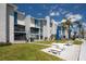 A lovely building with multiple units and outdoor patio spaces to enjoy the scenery at 171 Medallion Blvd # F, Madeira Beach, FL 33708