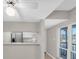 The kitchen features white cabinets and stainless appliances at 171 Medallion Blvd # F, Madeira Beach, FL 33708