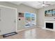 Bright living room features neutral walls, tile flooring, and a decorative fireplace at 171 Medallion Blvd # F, Madeira Beach, FL 33708