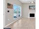 Bright living room features neutral walls, tile flooring, and a decorative fireplace at 171 Medallion Blvd # F, Madeira Beach, FL 33708
