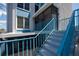 This stairway has blue railings and leads to a private entrance with access to a screened lanai at 171 Medallion Blvd # F, Madeira Beach, FL 33708