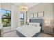 Comfortable bedroom showcases natural light and neutral decor with plush furnishings at 17921 Nadine Pl, Nokomis, FL 34275