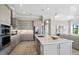 Spacious kitchen featuring a large island, stainless steel appliances, and ample cabinetry at 17921 Nadine Pl, Nokomis, FL 34275