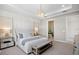 Comfortable main bedroom with tray ceiling and en-suite bathroom at 17921 Nadine Pl, Nokomis, FL 34275