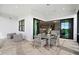Spacious covered patio offering seamless indoor-outdoor living with comfortable seating and dining areas at 17921 Nadine Pl, Nokomis, FL 34275