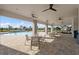 View of pool pavilion featuring ceiling fans, tables, chairs, and access to the community pool at 17921 Nadine Pl, Nokomis, FL 34275