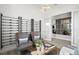 Elegant sitting room boasts stylish accents, ample seating, and abundant natural light at 17921 Nadine Pl, Nokomis, FL 34275