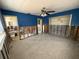 Bedroom with blue accent wall ready to be updated with open access to the bathroom at 195 45Th Ave, St Pete Beach, FL 33706