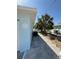 The house has a gravel path that goes along the side, with palm trees at 195 45Th Ave, St Pete Beach, FL 33706