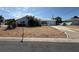 Charming single-story home with a light blue exterior, a stone garden, and an attached garage at 195 45Th Ave, St Pete Beach, FL 33706