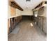 Image showcasing a living room being remodeled, with open studs and tile floors at 195 45Th Ave, St Pete Beach, FL 33706