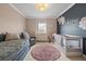 Charming bedroom with a unique design featuring a crib and daybed at 19810 Prince Benjamin Dr, Lutz, FL 33549