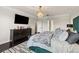 Elegant bedroom with a green bed frame, stylish chandelier, and spacious layout at 19810 Prince Benjamin Dr, Lutz, FL 33549
