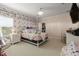 Cozy bedroom with colorful accent wall and comfortable decor at 19810 Prince Benjamin Dr, Lutz, FL 33549
