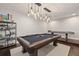 Well-appointed billiard room with a pool table, game table, and custom lighting at 19810 Prince Benjamin Dr, Lutz, FL 33549