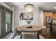 Dining area with round table and view of kitchen and backyard at 19810 Prince Benjamin Dr, Lutz, FL 33549