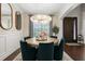 Cozy dining room showcases a round table, stylish chairs, and natural light from the window at 19810 Prince Benjamin Dr, Lutz, FL 33549
