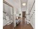 Bright foyer with soaring ceilings, hardwood floors, and an elegant chandelier, setting a grand entrance at 19810 Prince Benjamin Dr, Lutz, FL 33549