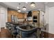 Spacious kitchen featuring a large island with seating and modern pendant lighting at 19810 Prince Benjamin Dr, Lutz, FL 33549
