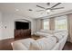 Spacious living room features a large sectional sofa, built-in entertainment center, and ceiling fan at 19810 Prince Benjamin Dr, Lutz, FL 33549