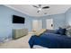 Serene main bedroom with soft blue walls, a large window, and ample closet space at 19810 Prince Benjamin Dr, Lutz, FL 33549