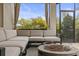 Comfortable outdoor seating area with a fire pit perfect for evenings in the screened patio at 19810 Prince Benjamin Dr, Lutz, FL 33549
