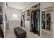 Large walk-in closet with custom shelving and seating at 19810 Prince Benjamin Dr, Lutz, FL 33549