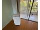 A Hisense AC unit is installed in the room providing a cool room atmosphere near the balcony at 2077 Canal Dr # L35, Bradenton, FL 34207