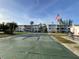 Recreational area with shuffleboard court, landscaping, and buildings in the background at 2077 Canal Dr # L35, Bradenton, FL 34207