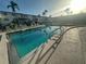 Outdoor pool with crystal clear water, poolside lounge chairs and building in the background at 2077 Canal Dr # L35, Bradenton, FL 34207